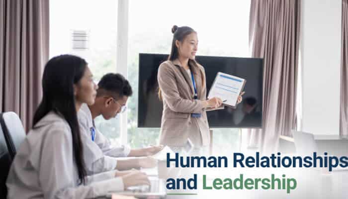 Human Relationships and Leadership - Robo Drone Tech - RoboDroneTech Why Technology Cannot Replace Humans RoarTechMental image showing a business leader presenting to a diverse team during a corporate meeting, highlighting human communication, emotional intelligence, leadership skills, teamwork, collaboration, and the irreplaceable role of human relationships in modern workplaces despite advances in artificial intelligence and automation.