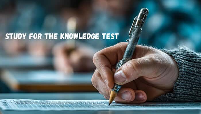Study for the Knowledge Test - Robo Dronetech - RoboDroneTech Close-up of a hand writing on an exam sheet with text “Study for the Knowledge Test,” representing preparation for the Part 107 Drone License exam and FAA commercial drone certification requirements.
