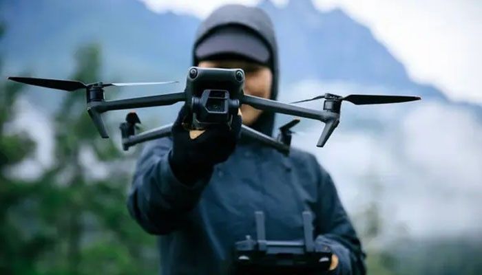 Potensic ATOM LT Best for Long Flight Time at a Lower Price - Robo Drone Tech - RoboDroneTech Best Budget Drones guide featuring a pilot holding a compact camera drone, representing affordable GPS models with long flight time and stabilized aerial imaging.